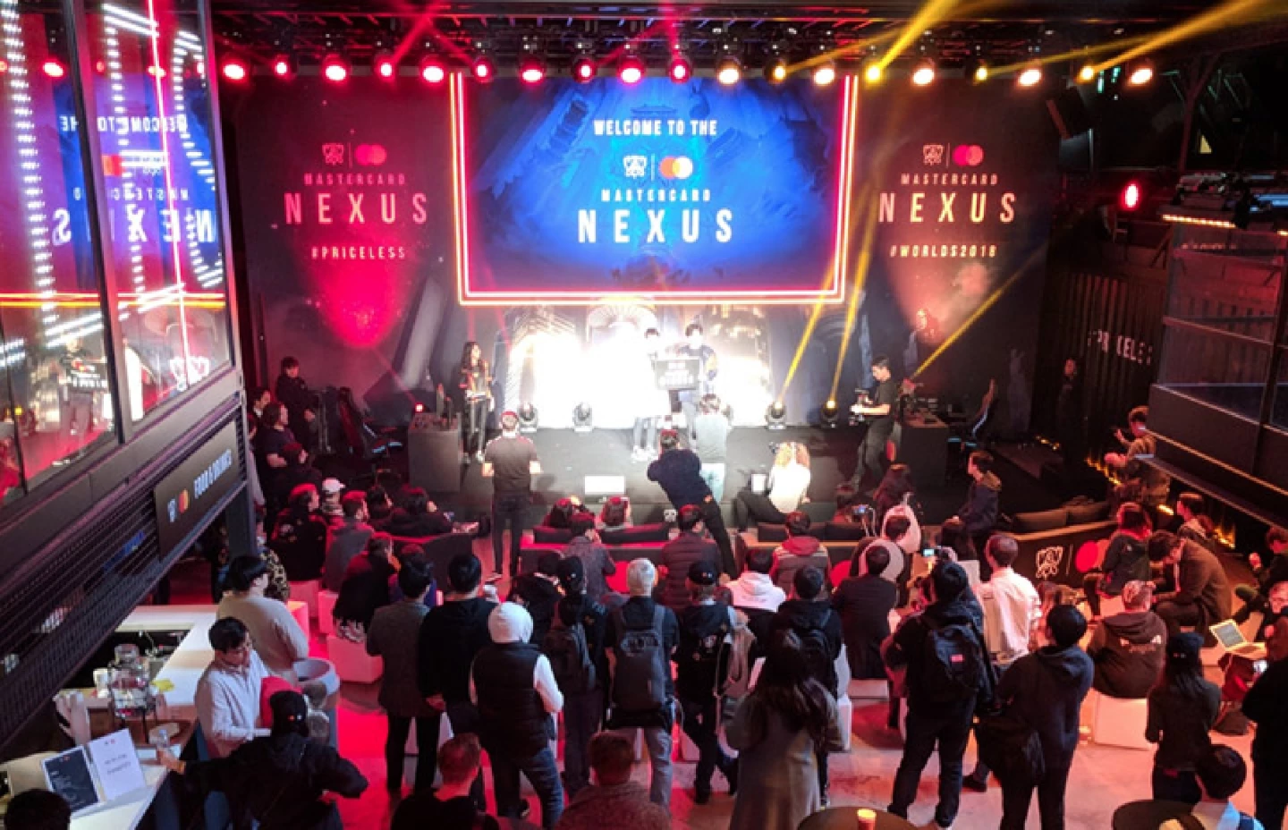 Room with presenters on stage hosting the Mastercard Nexus event