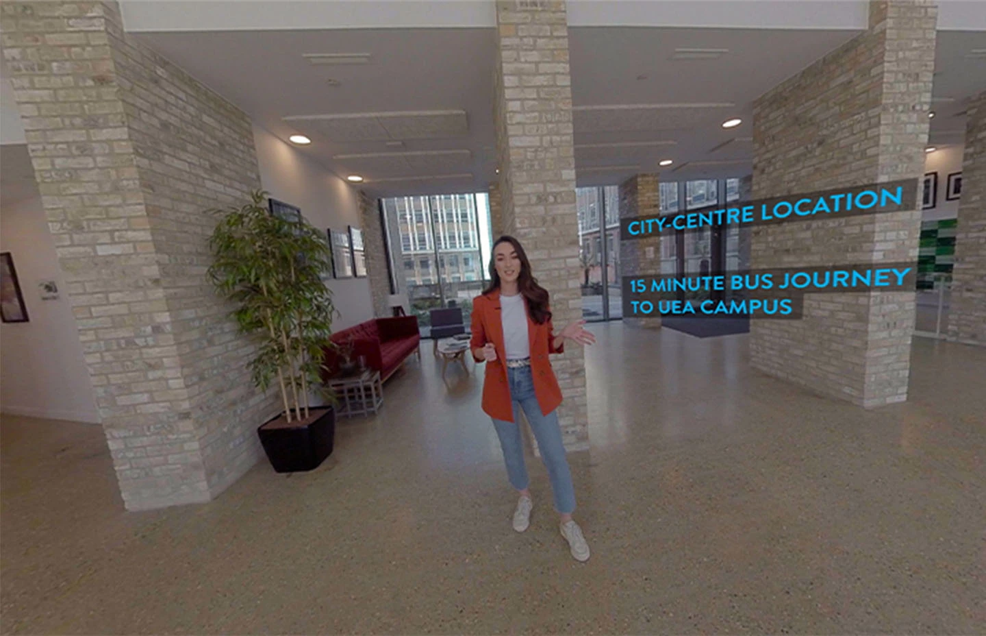 Student standing in student accommodation describing UEA location