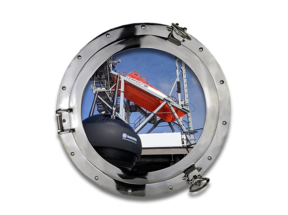 a porthole looking at a lifeboat