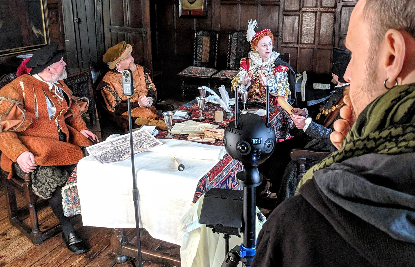 Elizabeth the First at dinner being filmed