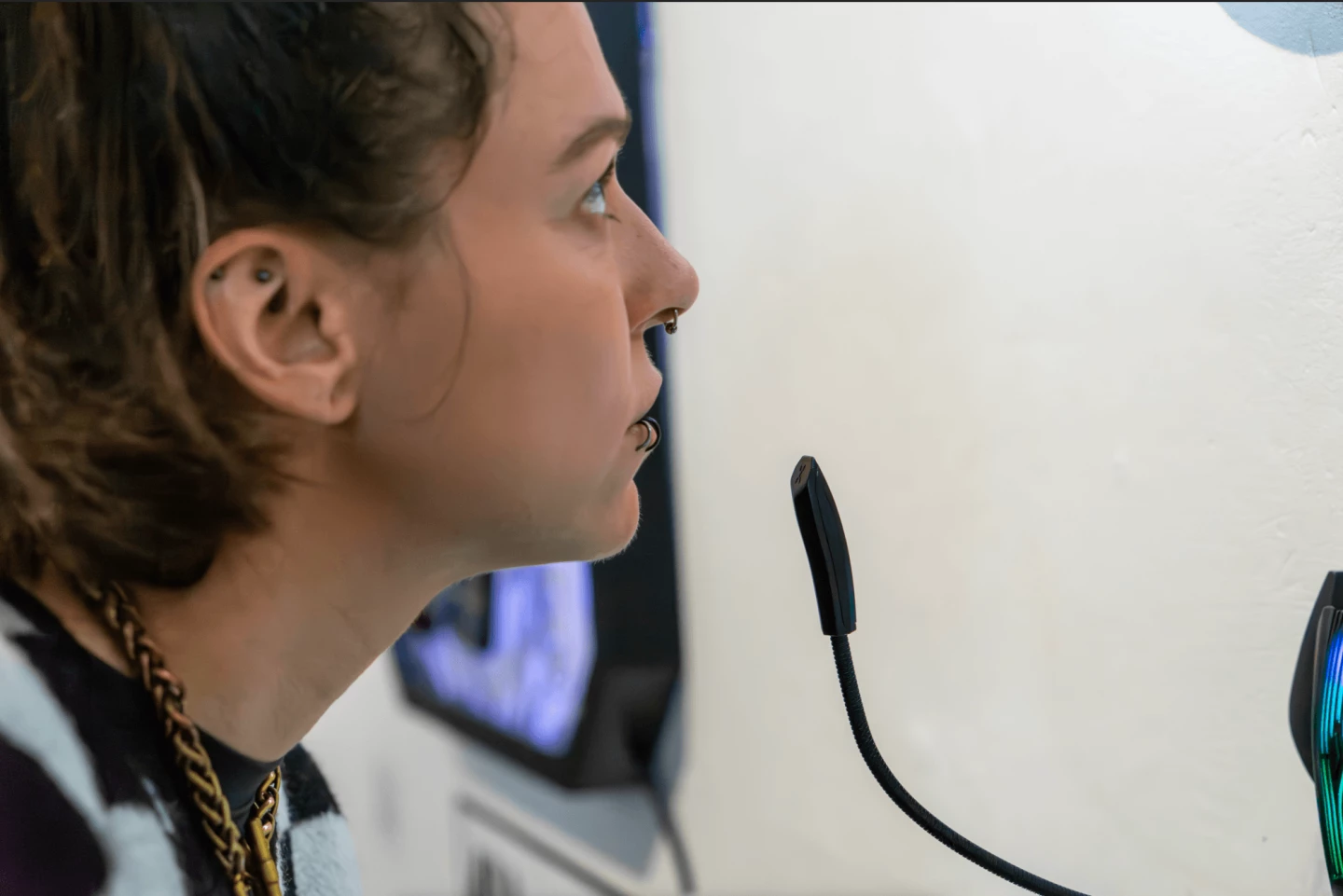 <img="microphone" alt="speaking into a microphone"